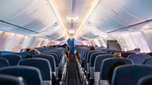 Aircraft cabin with a couple of passengers already seated